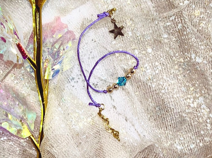 LIGHT Bracelet. Star LIGHT Charm. A Gold touch sparkled with aqua Swarvoski.