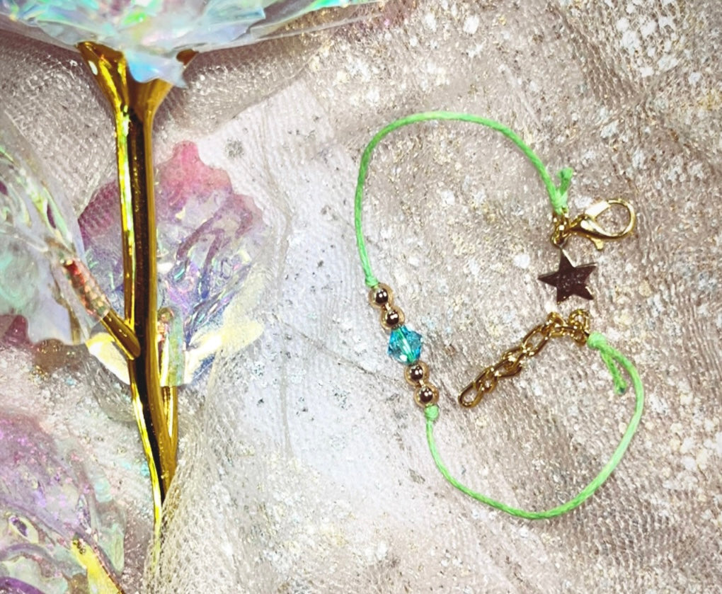 LIGHT Bracelet. Star LIGHT Charm. A Gold touch sparkled with aqua Swarvoski.