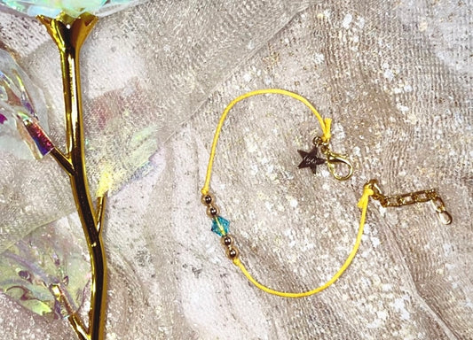 LIGHT Bracelet. Star LIGHT Charm. A Gold touch sparkled with aqua Swarvoski.