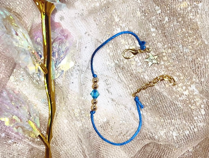 LIGHT Bracelet. Star LIGHT Charm. A Gold touch sparkled with aqua Swarvoski.